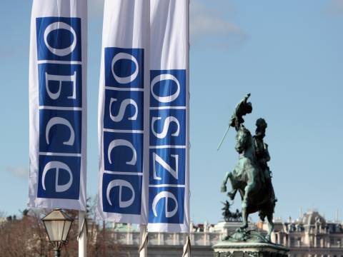 flags outside osce headquarters in Vienna